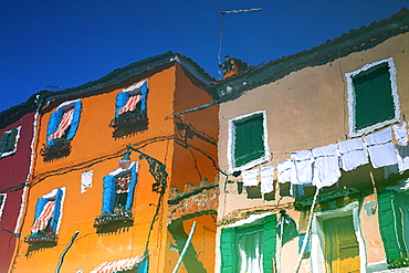 Reflections In Water Of Burano, Italy