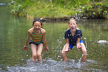 Girls Playing In Water