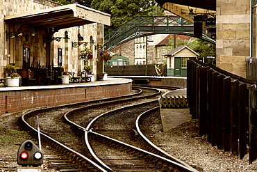 An Old-Fashioned Train Station And Tracks