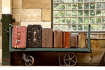 Suitcases On A Luggage Trolley In A Train Station