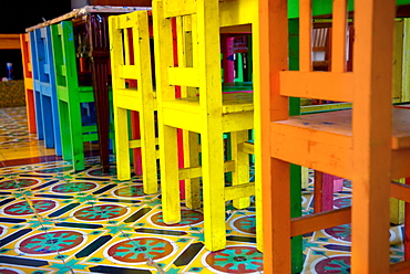 Mexico, Colorful Chairs On A Tiled Floor