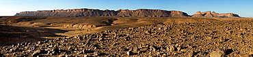 Dry Land Below A Mountain Range