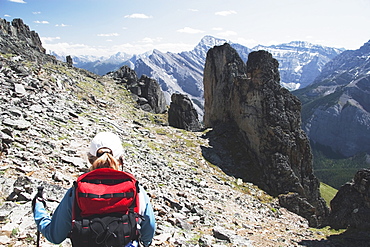 Woman Hiking On A Mountain Trail