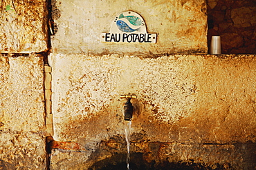 Gourdon, Provence, France, Water Tap With A Sign Saying 'eau Potable'