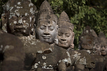 Statues Lining Main Gates Of Ancient City, Angkor Wat, Cambodia