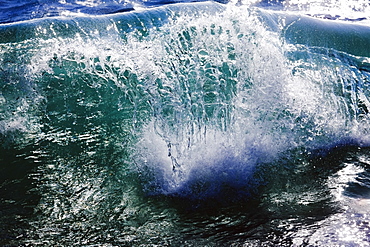 Hawaii, United States Of America, Sunlight Forms Rays In Sea Water Just As A Wave Breaks