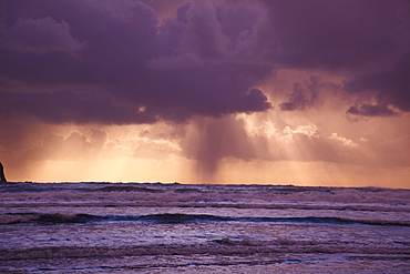 Oregon, United States Of America, Storm Clouds Over The Water At Sunset