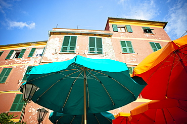 Green And Yellow Patio Umbrellas Beside A Building, Vernazza, Liguria, Italy