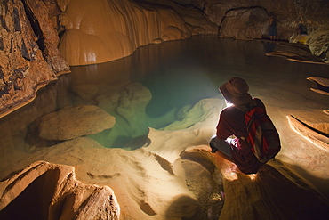 A Filipino Tour Guide Holds A Lantern Inside Sumaging Cave Or Big Cave Near Sagada, Luzon, Philippines