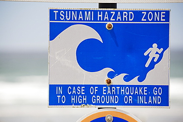 Tsunami Warning Sign With The Ocean In The Background, Lincoln City, Oregon, United States of America