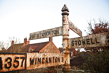 Old style road sign on A357 on the edge of South Cheriton village, Somerset England