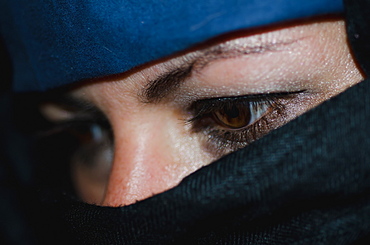 A woman wearing a hijab with only her eyes showing, Locarno ticino switzerland