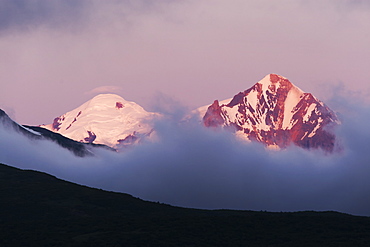 Mountain Peaks Above The Clouds On Hallo Bay, Katmai Naional Park, Alaska Peninsula, Southwest Alaska, United States Of America