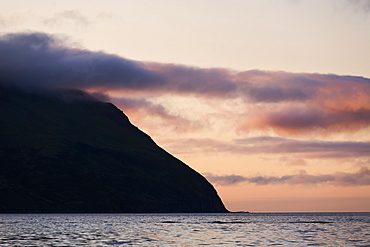 Clouds Colored By The Setting Sun Near King Cove, Alaska Peninsula, Southwest Alaska, United States Of America