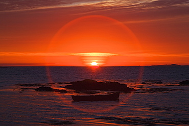 Sunset over mannin bay in a circular glare, County galway, ireland