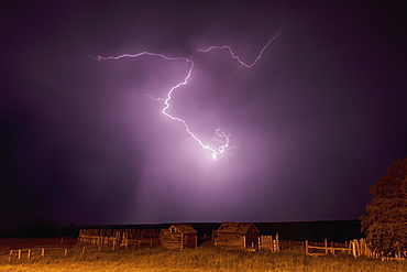 Lightning bolt over some abandoned buildings near val marie, Saskatchewan canada