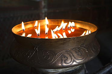 Flames burning in a bronze container at the jokhang temple, Lhasa xizang china