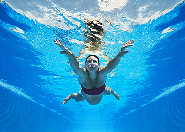 A pregnant woman swimming underwater, Tarifa cadiz andalusia spain