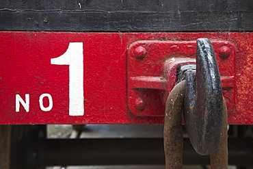 A large metal hook and chain link on the back of a train car labeled number one, Shildon durham england