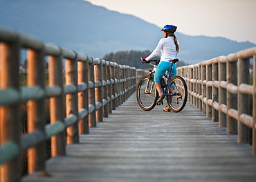 A Cyclist On A Wooden Boardwalk, Tarifa, Cadiz, Andalusia, Spain