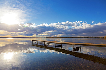 A Dock Leading Out Into The Lake At Sunrise, Pigeon Lake, Alberta, Canada