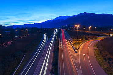 Light Trails Of Vehicle Lights On A Road At Dusk, Locarno, Ticino, Switzerland