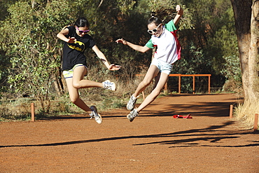 Two Girls Leaping In The Air Together, Australia