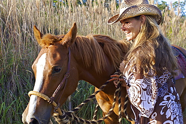 A Woman Walking With Her Horse, Hawaii, United States Of America