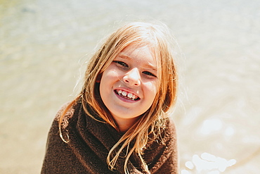 Portrait Of A Girl Wrapped In A Towel With Water In The Background, Peachland, British Columbia, Canada