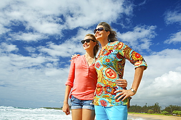 A Mother And Daughter Together On The Beach, Kauai, Hawaii, United States Of America