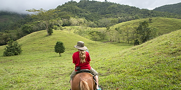 A Girl Riding Horseback Through The Hills, Zacapa, Guatemala