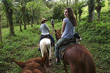 A Young Woman And Her Mother Riding Horses On A Trail, Zacapa, Guatemala