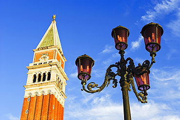 A Tower And Lamp Post In Piazza San Marco, Venice, Italy