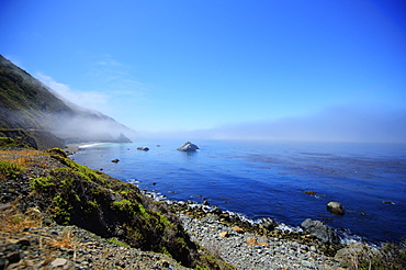 Seascape Of The Pacific Ocean Near Big Sur In California With The Fog Rolling Over The Horizon, California, United States Of America