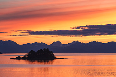 A Summer Sunset Colours The Sky Adjacent To Lynn Canal, With Chilkat Mountains In The Distance, Alaska, United States Of America