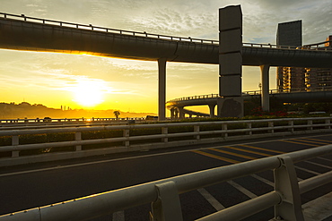 Highway From Xiamen City, China At Sunset, With Gulangyu Island In The Background, Xiamen, China