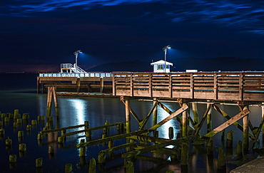 17th Street Pier Is Illuminated On A Summer Evening, Astoria, Oregon, United States Of America