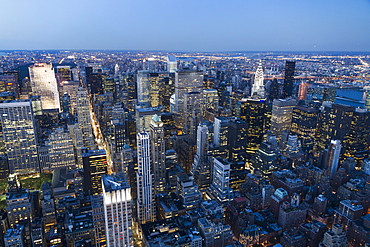 Panoramic View Of The Skyscrapers And The East River At Dusk, As Seen From The Empire State Building, New York City, New York, United States