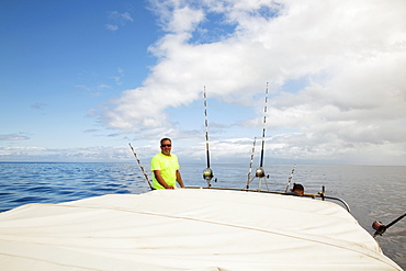 Hawaii, Maui, Man Poses With Poles On Fishing Boat