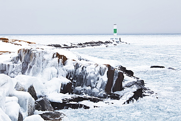 Ice On Lake Superior With A Lighthouse, Thunder Bay, Ontario, Canada