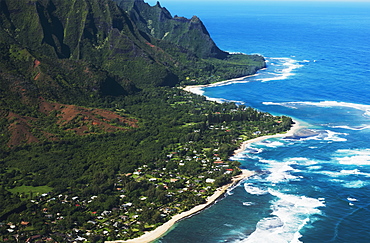 Rugged Mountains Along The Coastline And The Surf Meets The Beach, Haena, Hawaii, United States Of America