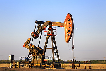 Oil Well Pump Jack In The Bakken Oil Field, Near Estevan, Saskatchewan, Canada