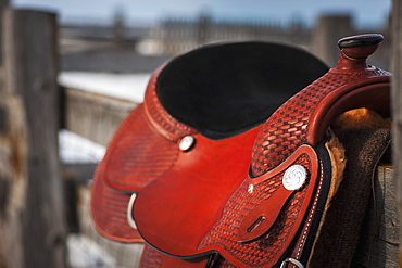 Close Up Of A Saddle On A Wooden Fence, Regina, Saskatchewan, Canada