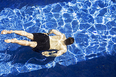 Male Swimming Under Water In Pool, Akumal, Quintana Roo, Mexico