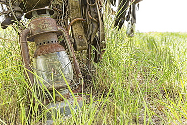 An Old Lantern Lay Against A Post In Rural Saskatchewan, Val Marie, Saskatchewan, Canada