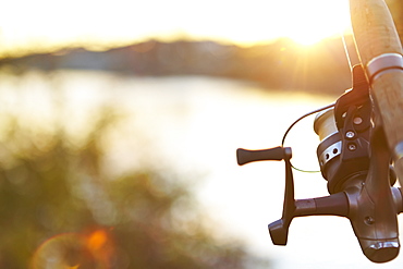 Fishing Rod And Tranquil Water At Sunset, Quebec, Canada