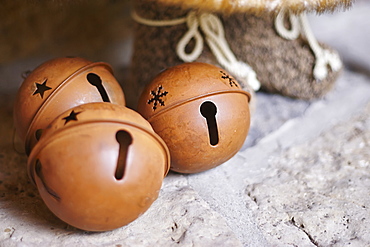 Christmas Bell Decorations On Stone Fireplace, Ontario, Canada