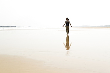 Young Woman Walking On The Beach From Huohu, North Of Kinmen Island, Taiwan