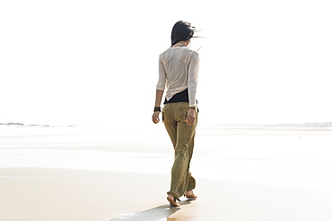 Young Woman Walking On The Beach, Huohu, Taiwan