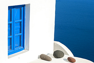 Whitewash Building With Blue Trimmed Window Along The Aegean Sea, Oia, Santorini, Greece